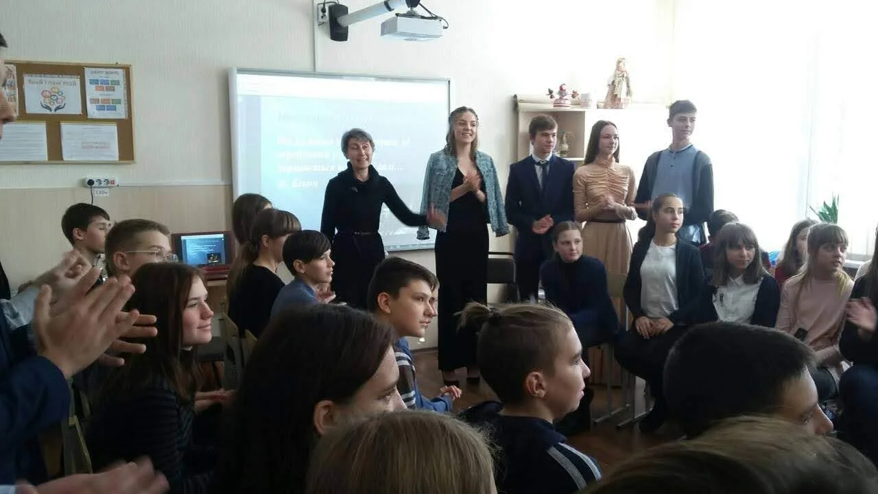 Mathematics teacher and webmaster Svitlana Pasko with students in the science room